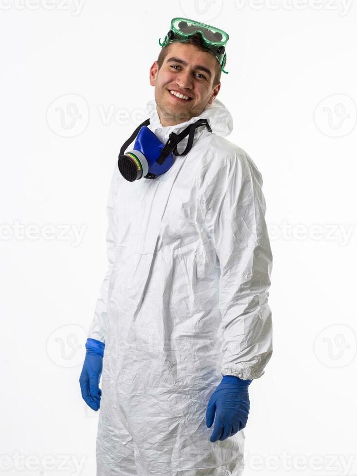 Doctor wearing protective biological suit and mask due to coronavirus 2019-nCoV global pandemic warning and danger background against white background. photo