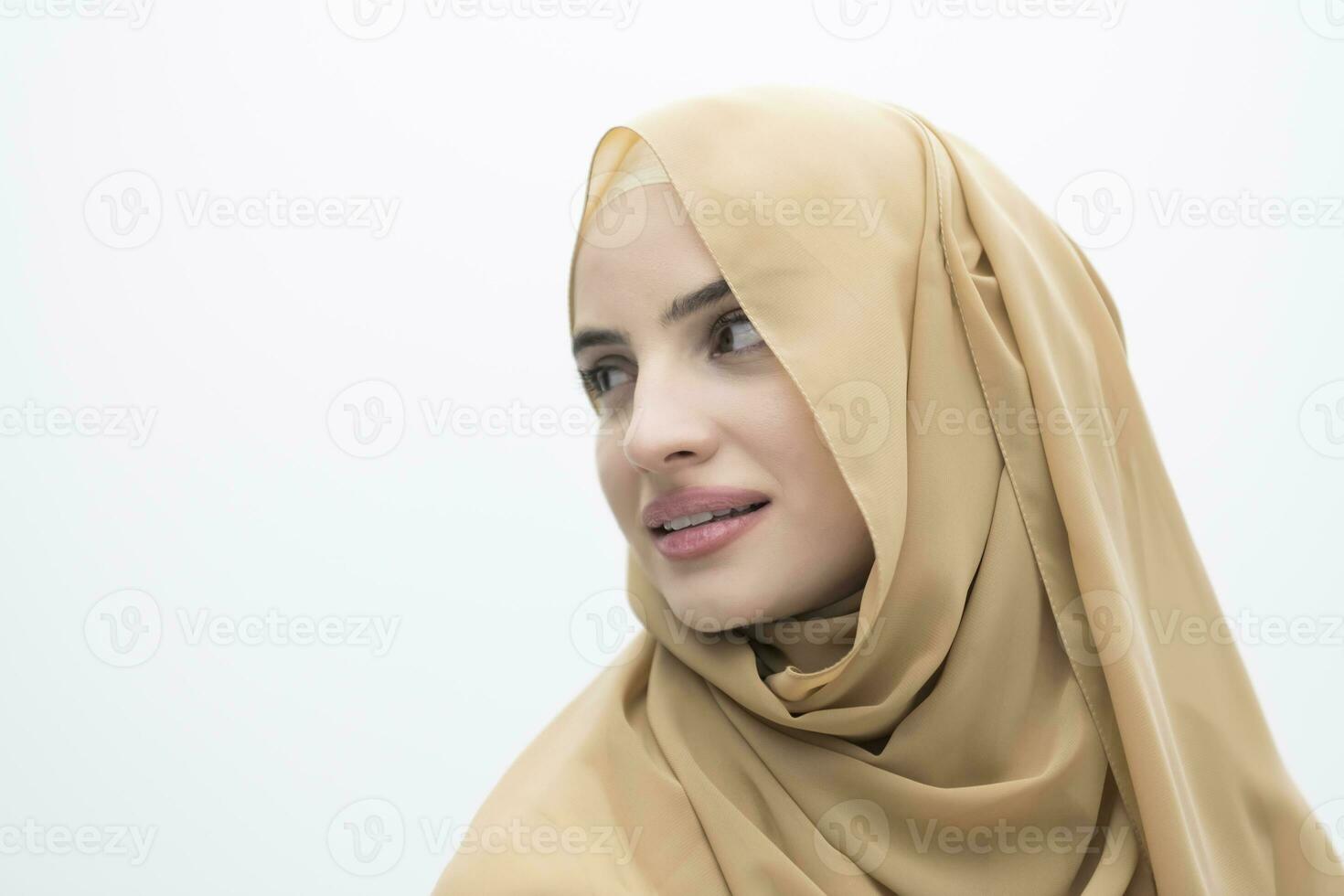 Portrait of young muslim woman wearing hijab on isolated white background photo
