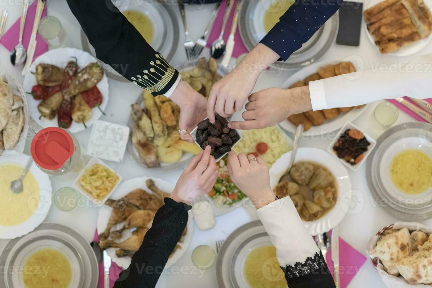 Top view of muslim family having Iftar during Ramadan holy month photo