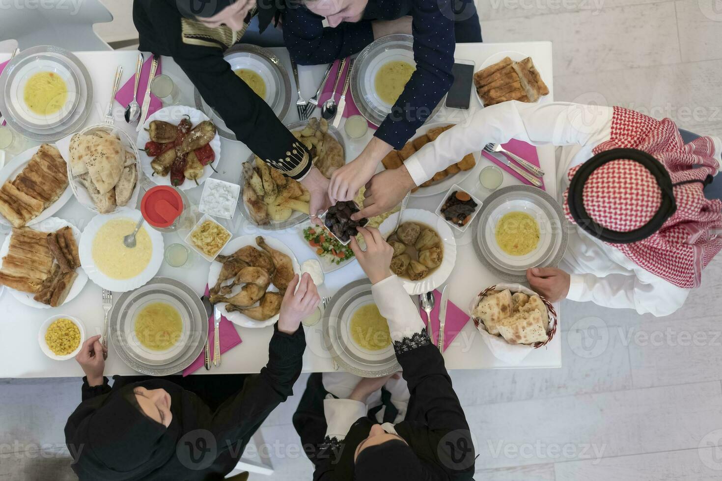 Top view of muslim family having Iftar during Ramadan holy month photo
