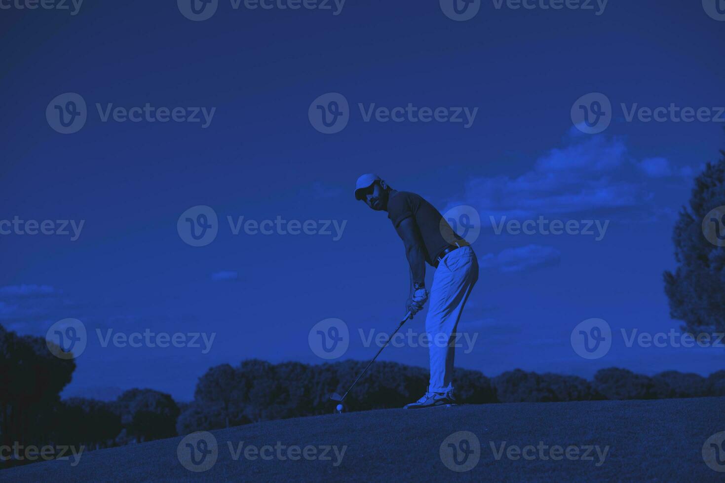 golf player hitting long shot photo