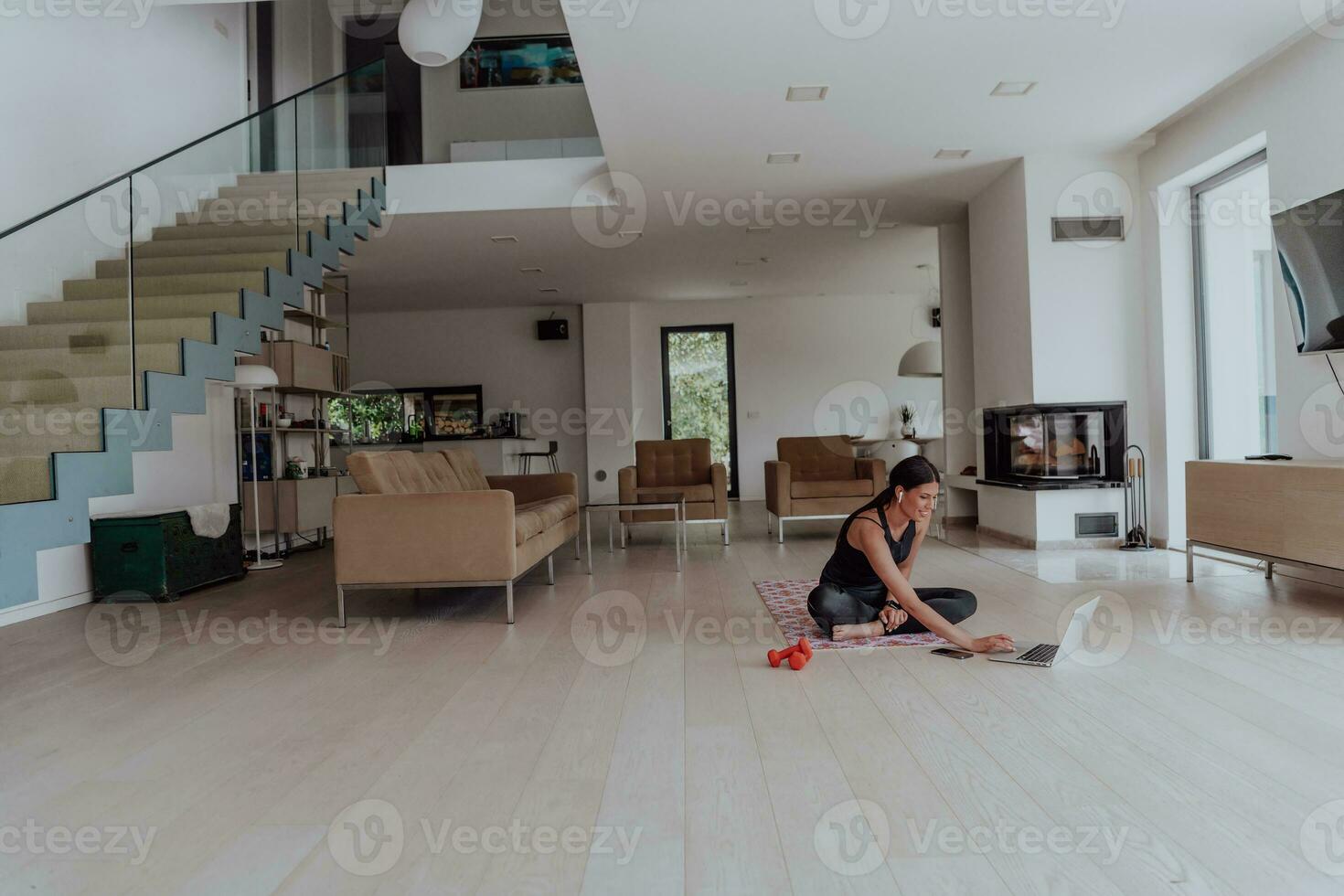 Young Beautiful Female Woman with Trainer via Video Call Conference in Bright Sunny House. Healthy Lifestyle, Wellbeing and Mindfulness Concept. photo