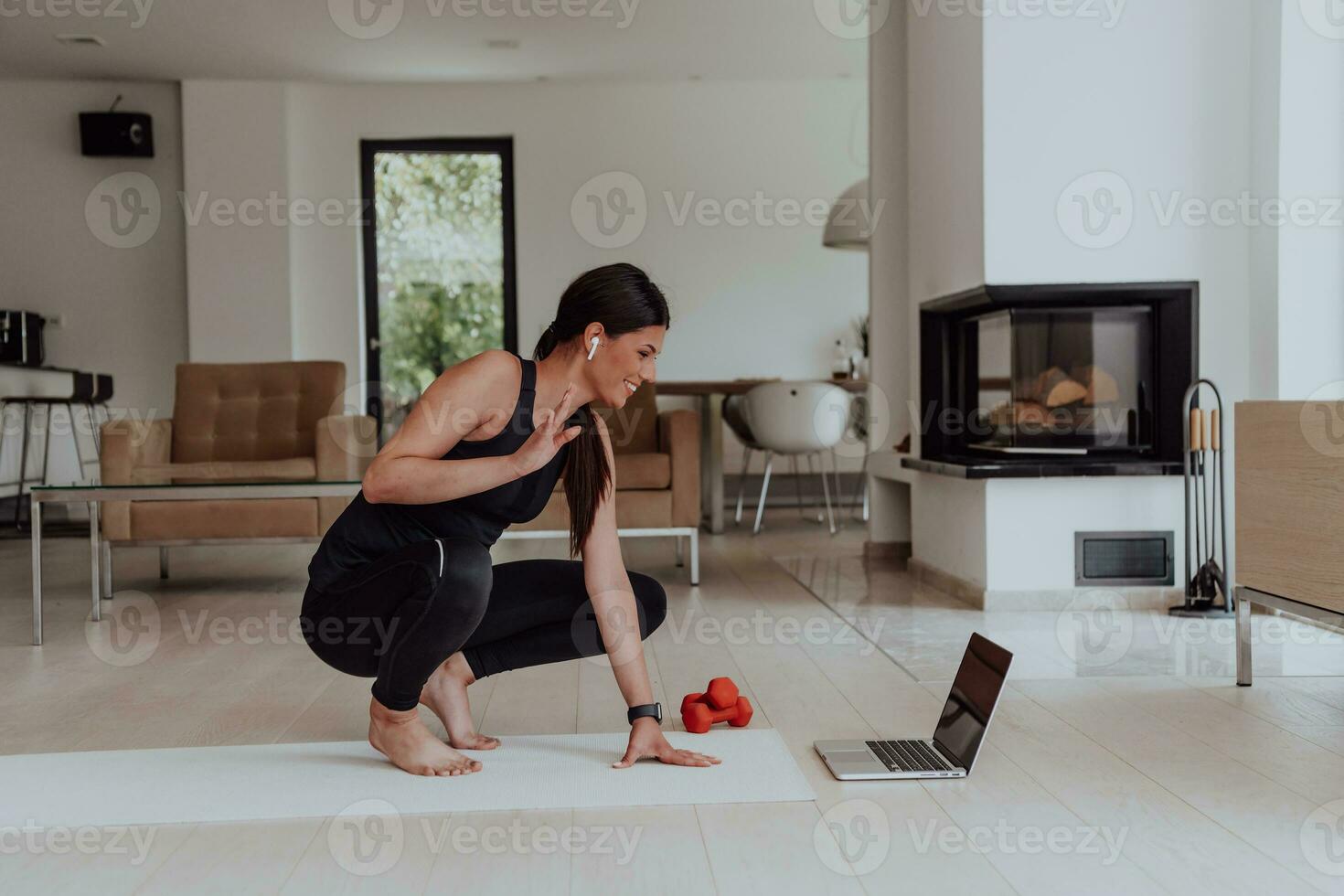 Young Beautiful Female Woman with Trainer via Video Call Conference in Bright Sunny House. Healthy Lifestyle, Wellbeing and Mindfulness Concept. photo