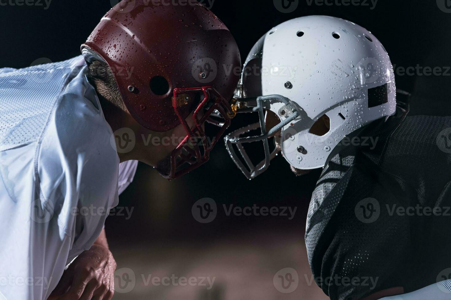 two american football players face to face in silhouette shadow on white background photo