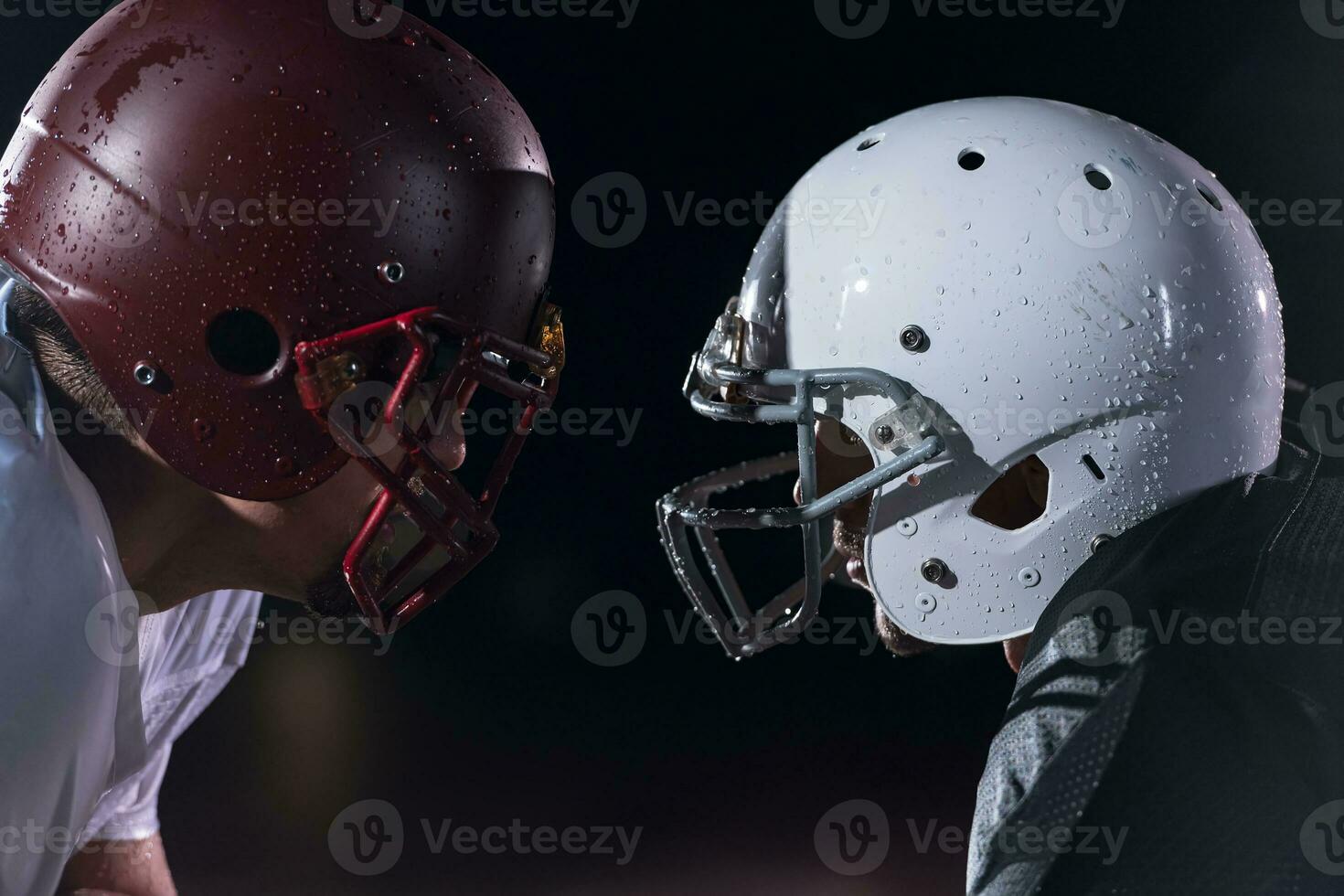 two american football players face to face in silhouette shadow on white background photo