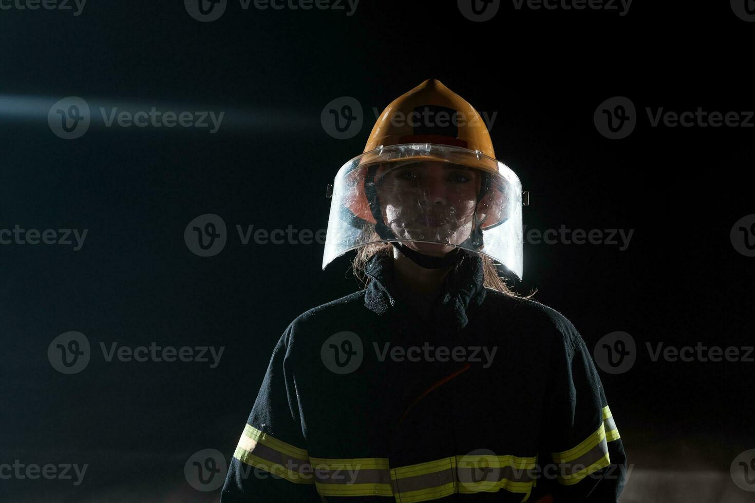 Portrait of a female firefighter standing and walking brave and optimistic. photo