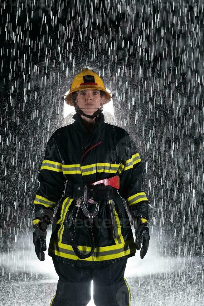 Portrait of a female firefighter standing and walking brave and optimistic. photo