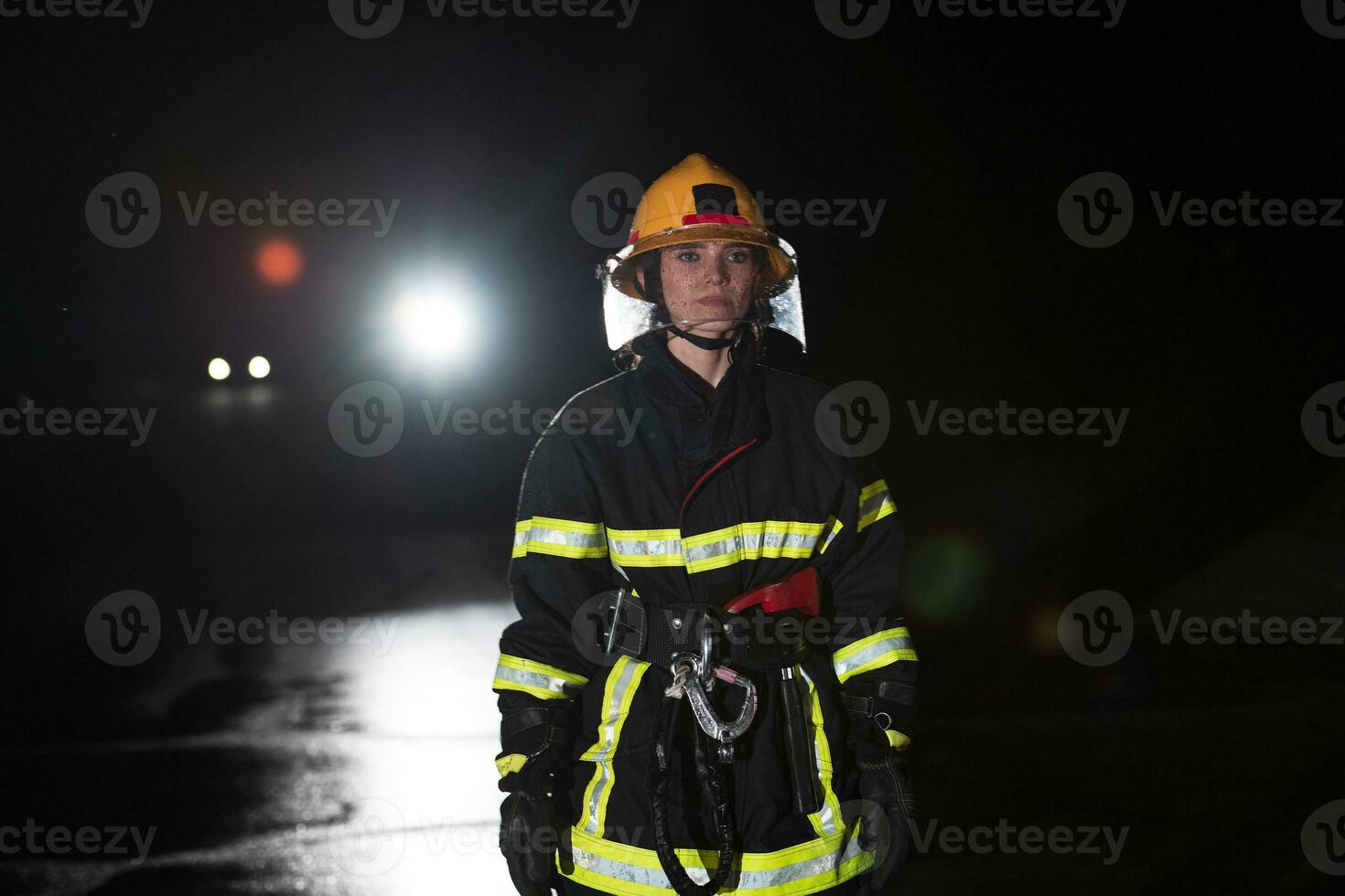 Portrait of a female firefighter standing and walking brave and optimistic. photo