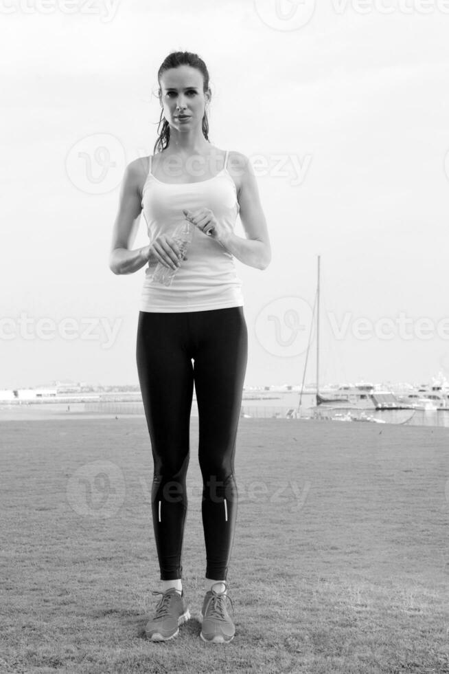 Young beautiful  woman jogging  on morning photo