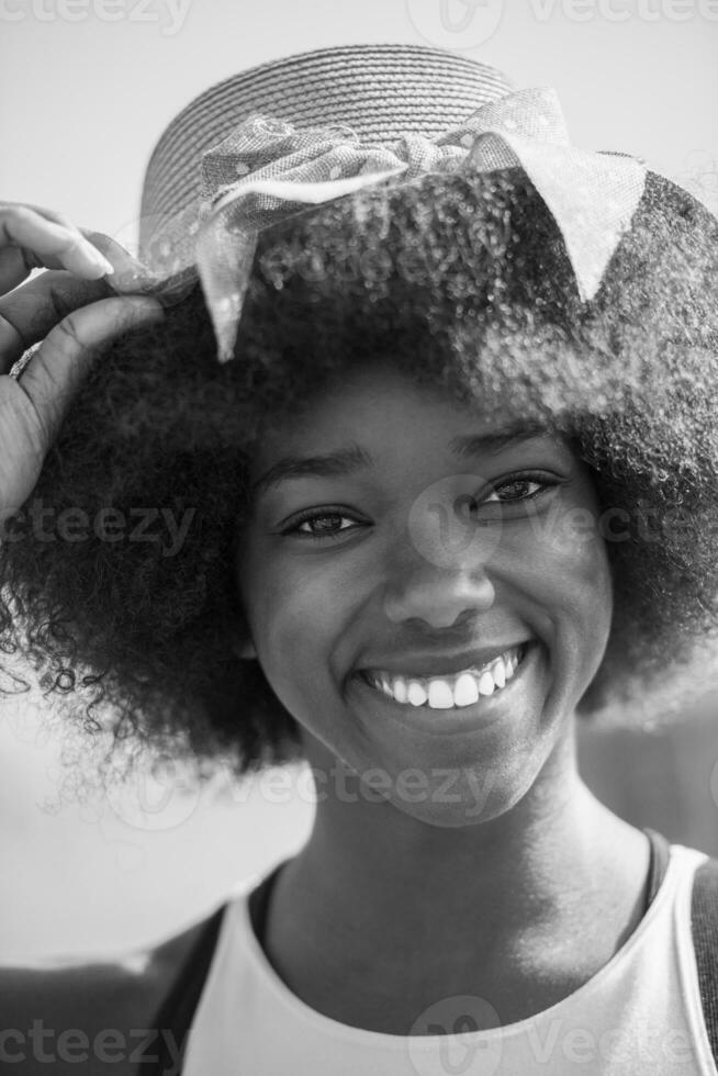Close up portrait of a beautiful young african american woman smiling and looking up photo
