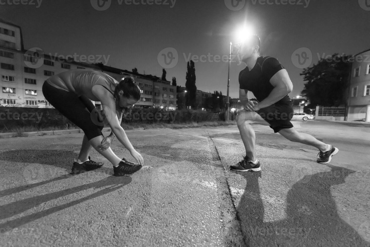 couple warming up and stretching photo