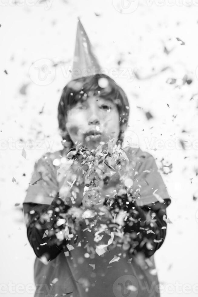 kid blowing confetti photo
