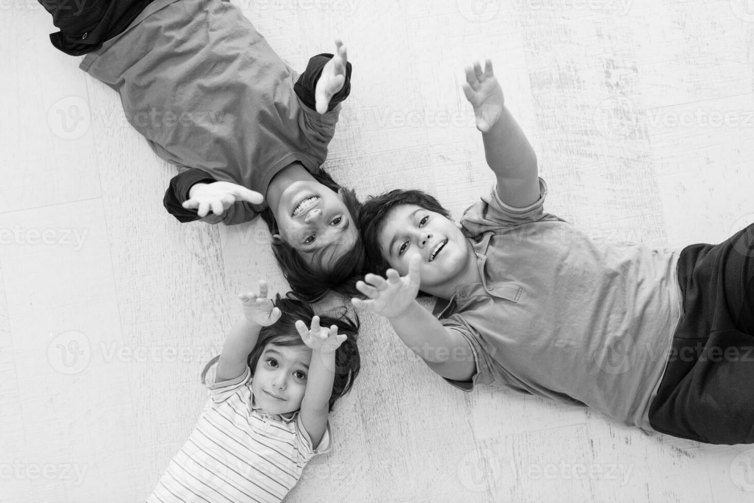 young boys having fun on the floor photo