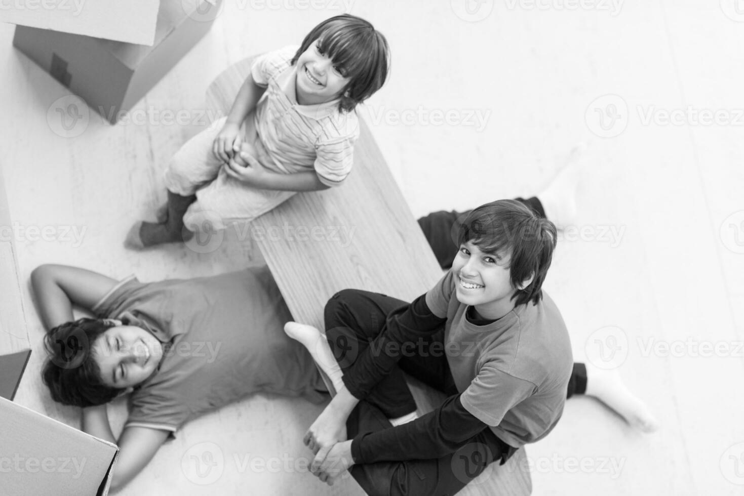 boys with cardboard boxes around them top view photo