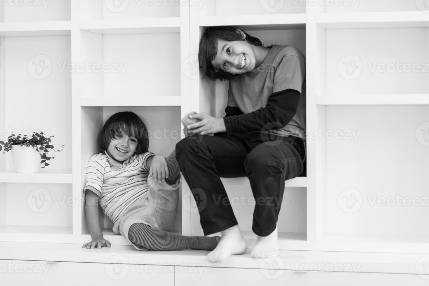 young boys posing on a shelf photo
