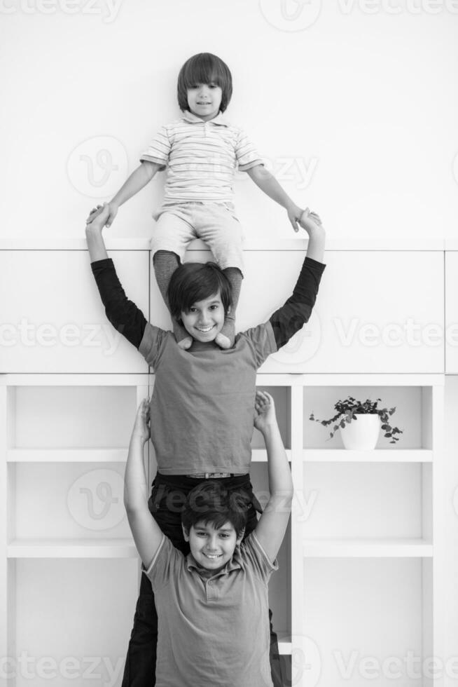 young boys posing line up piggyback photo