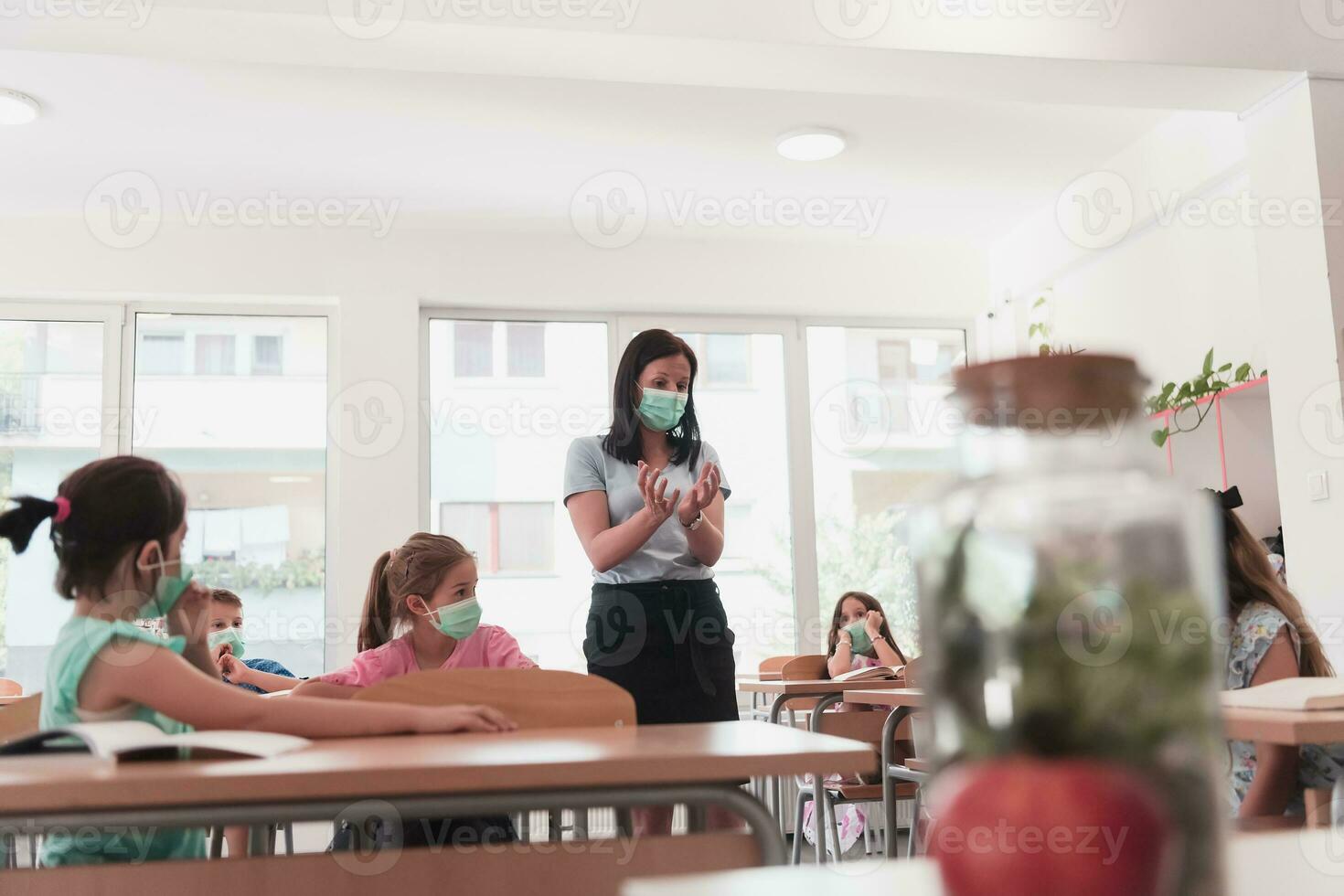 Preschool education. Students at school play interesting games with the teacher for the purpose of education photo