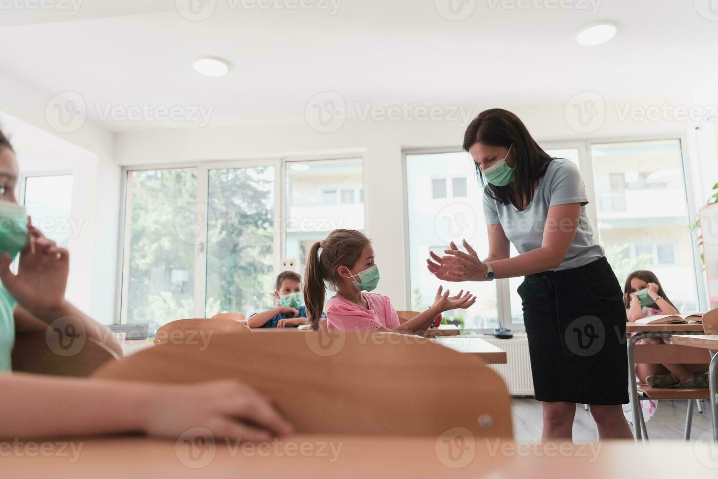 Preschool education. Students at school play interesting games with the teacher for the purpose of education photo