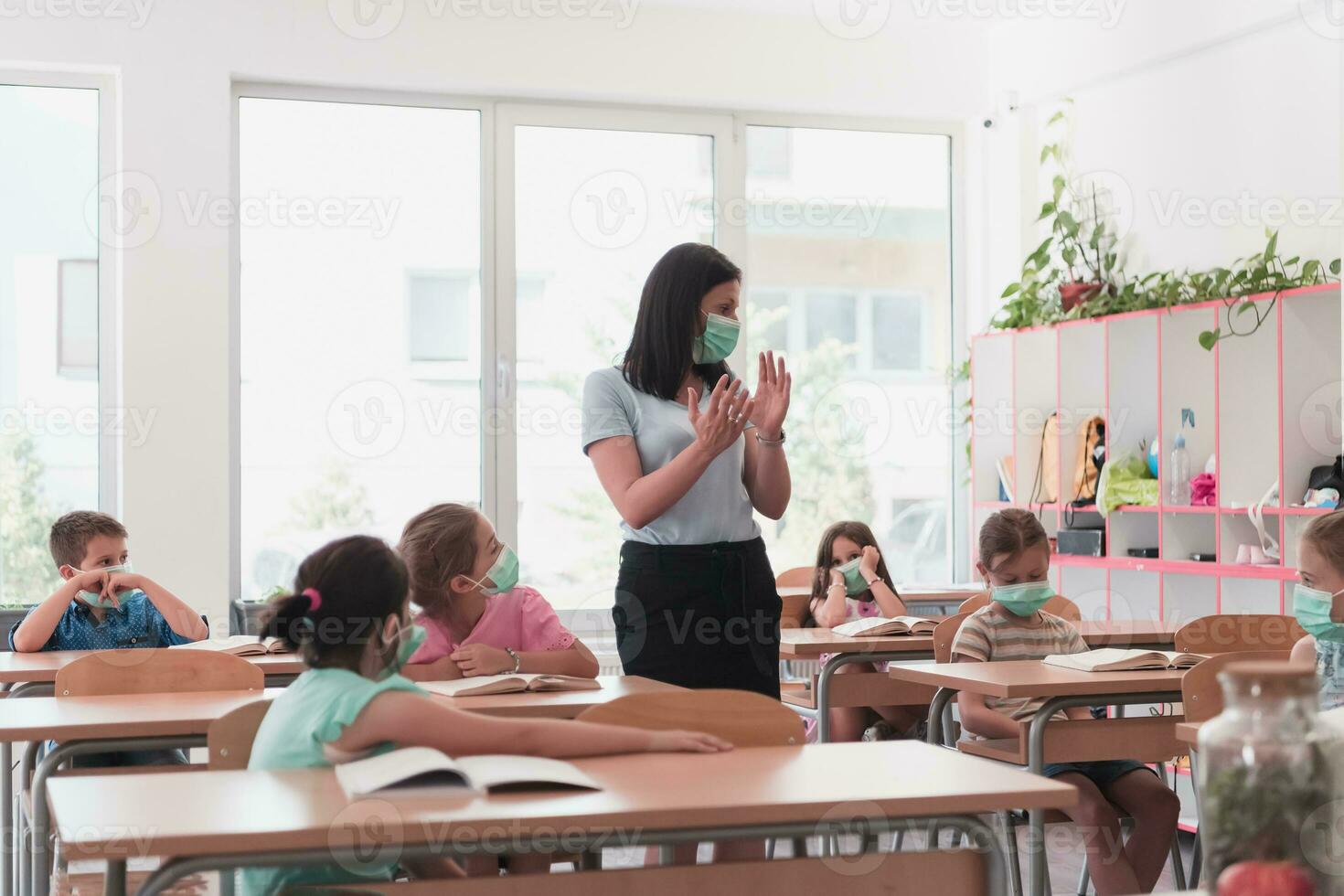 Preschool education. Students at school play interesting games with the teacher for the purpose of education photo