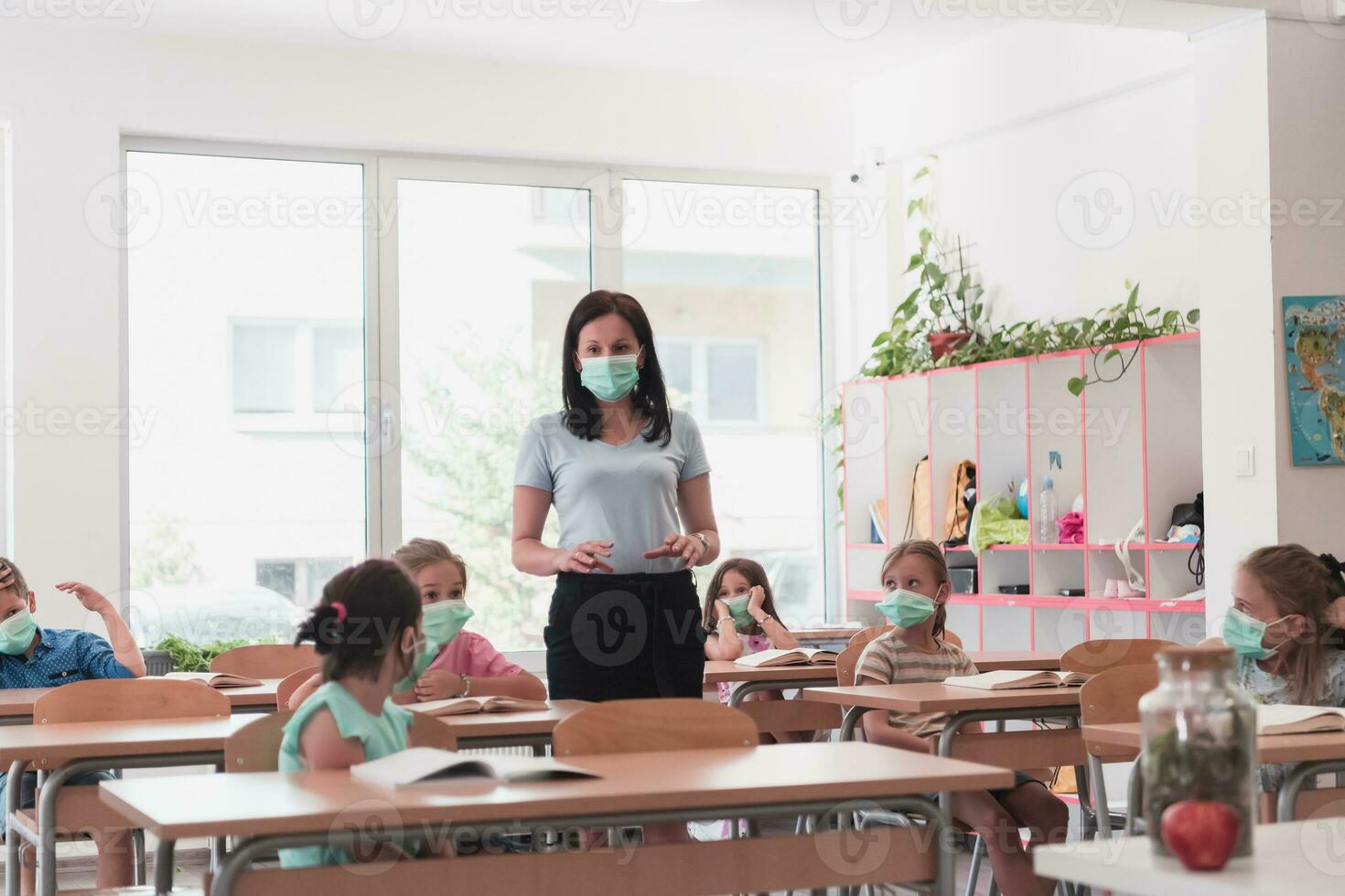 Preschool education. Students at school play interesting games with the teacher for the purpose of education photo