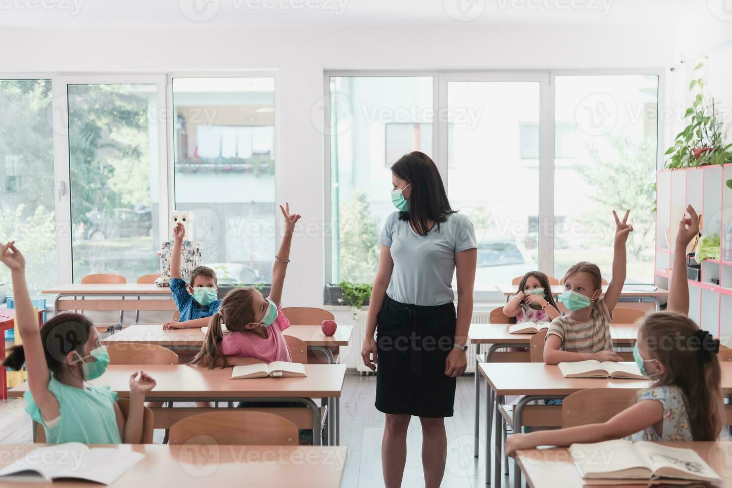 Preschool education. Students at school play interesting games with the teacher for the purpose of education photo