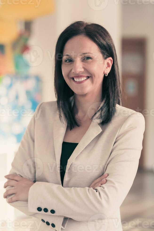 Young businesswoman smiling happy with arms crossed. Selctive focus photo