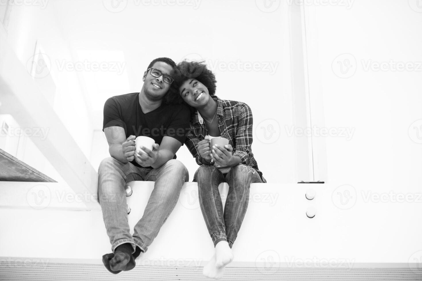 couple having break during moving to new house photo