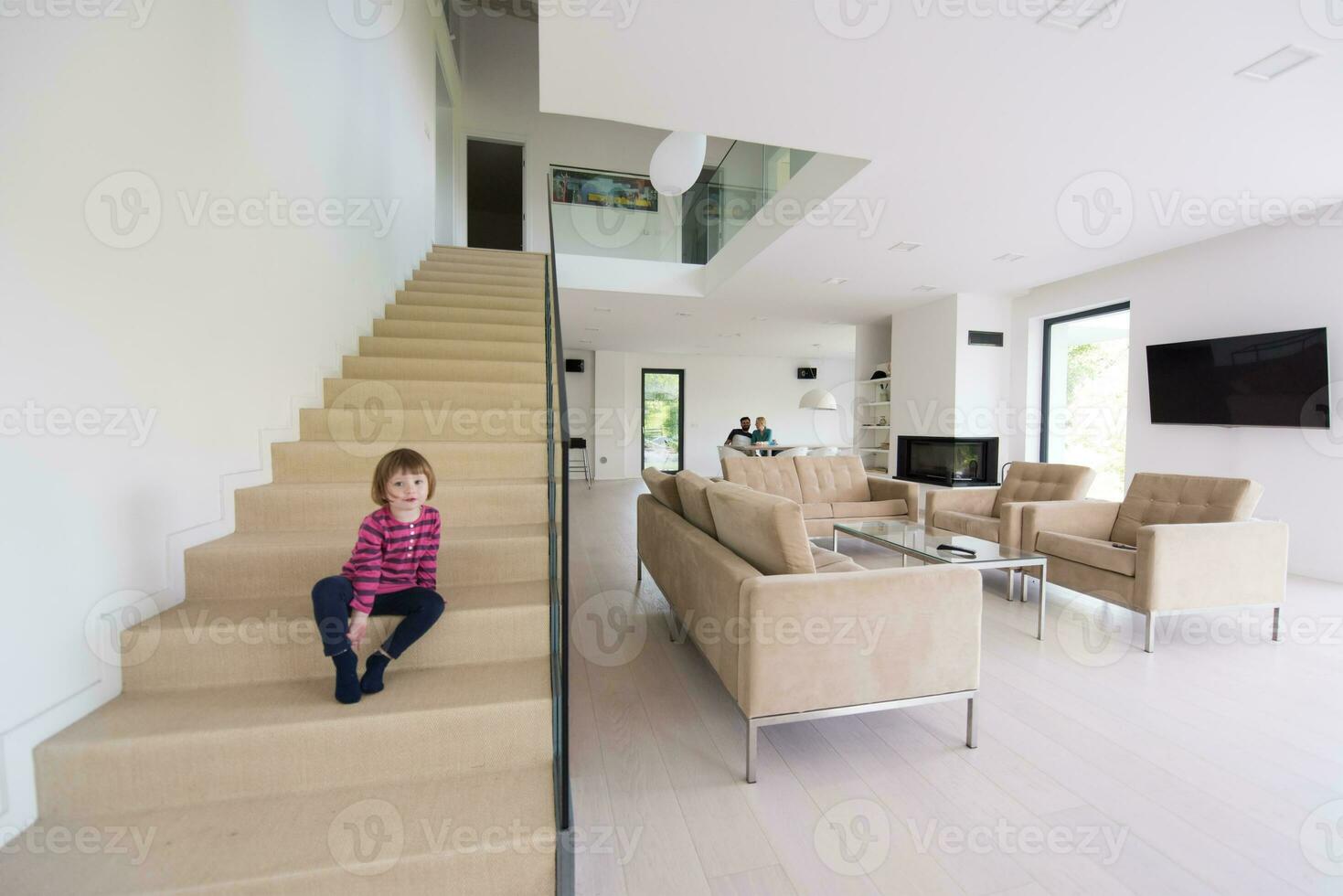 family with little girl enjoys in the modern living room photo