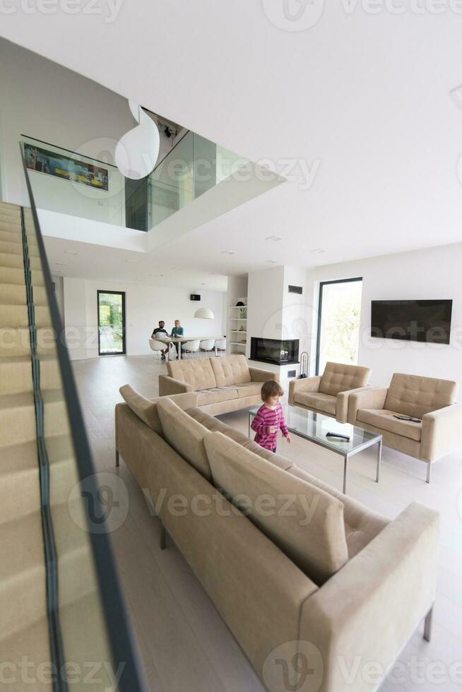 family with little girl enjoys in the modern living room photo
