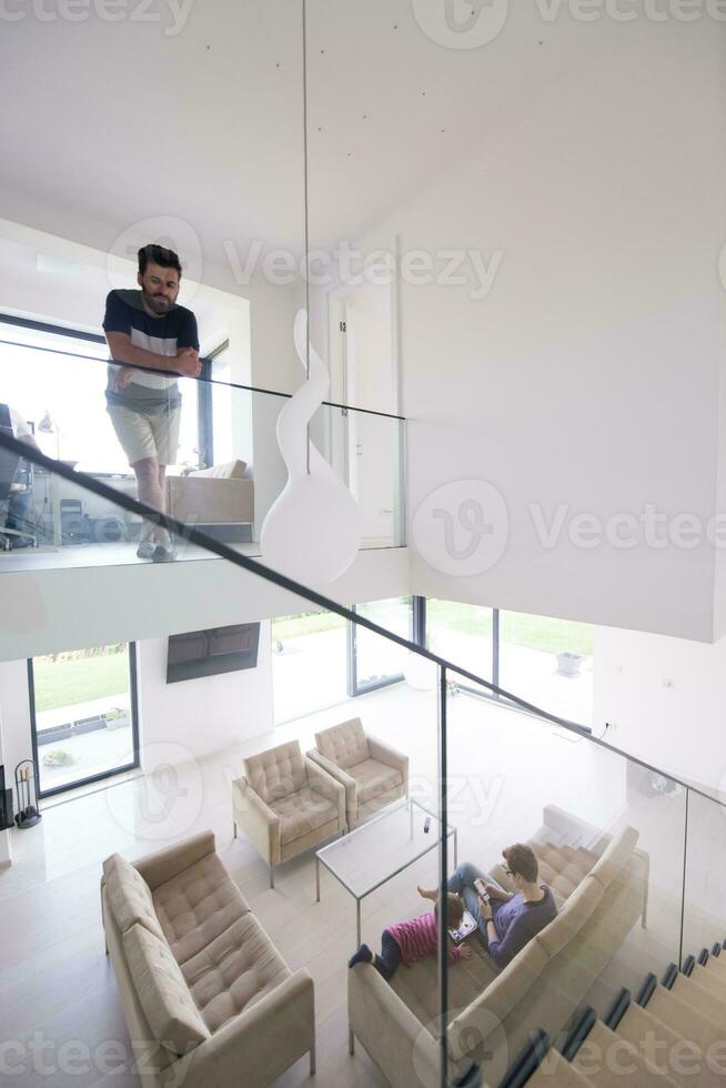 family with little girl enjoys in the modern living room photo
