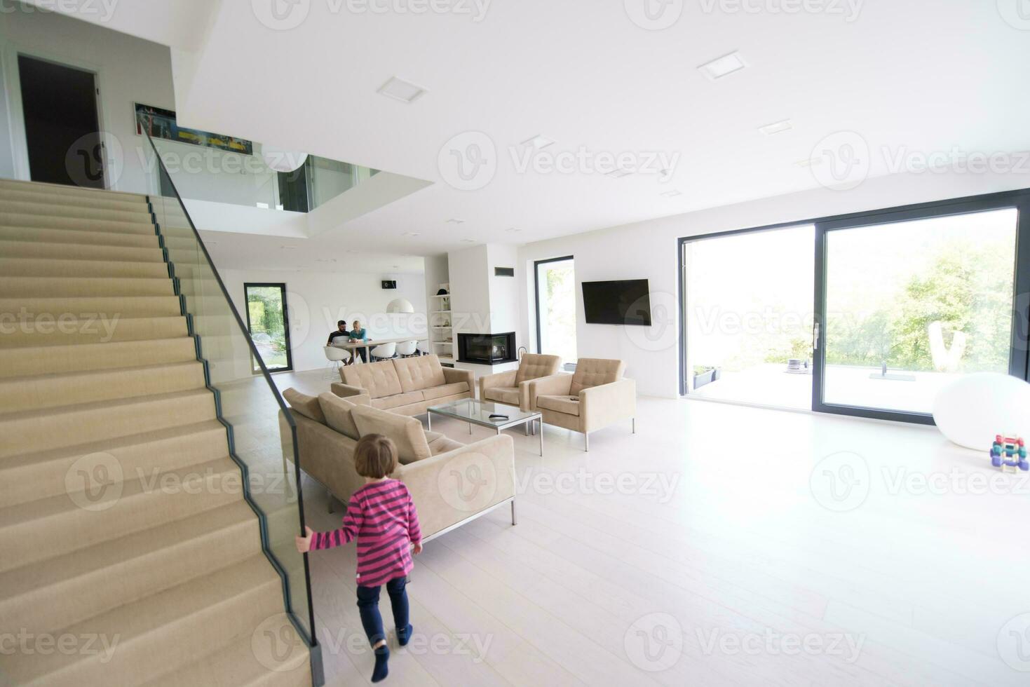 family with little girl enjoys in the modern living room photo