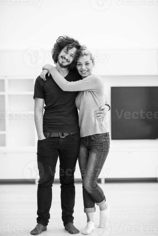 couple hugging in their new home photo