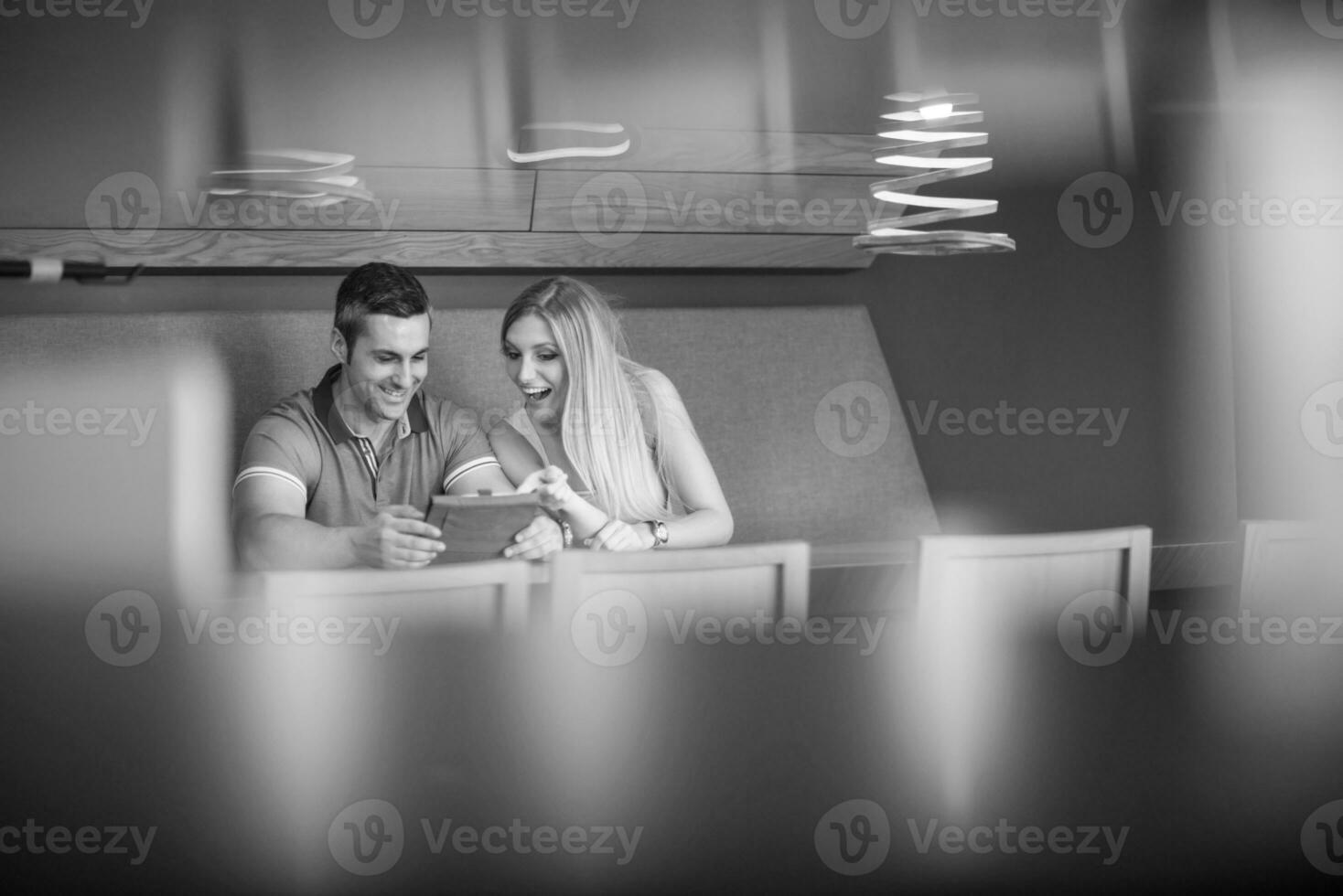 couple using tablet at home photo