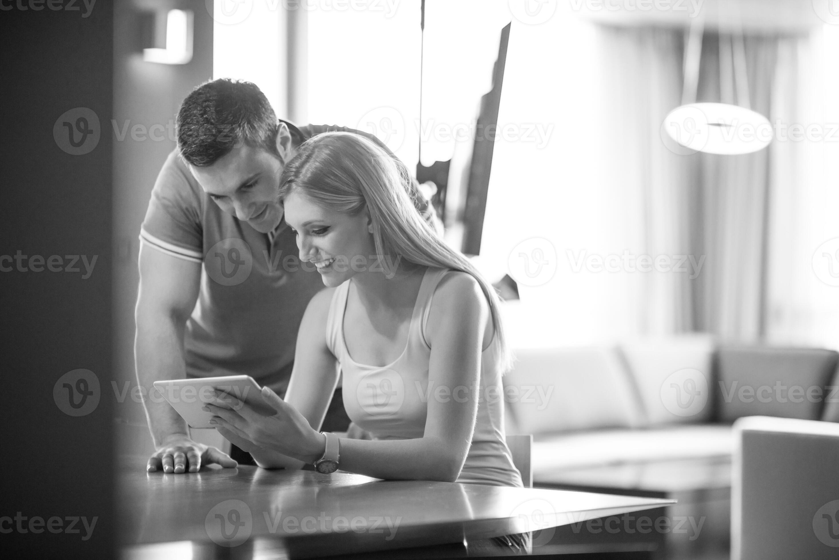 couple-using-tablet-at-home-31041636-stock-photo-at-vecteezy