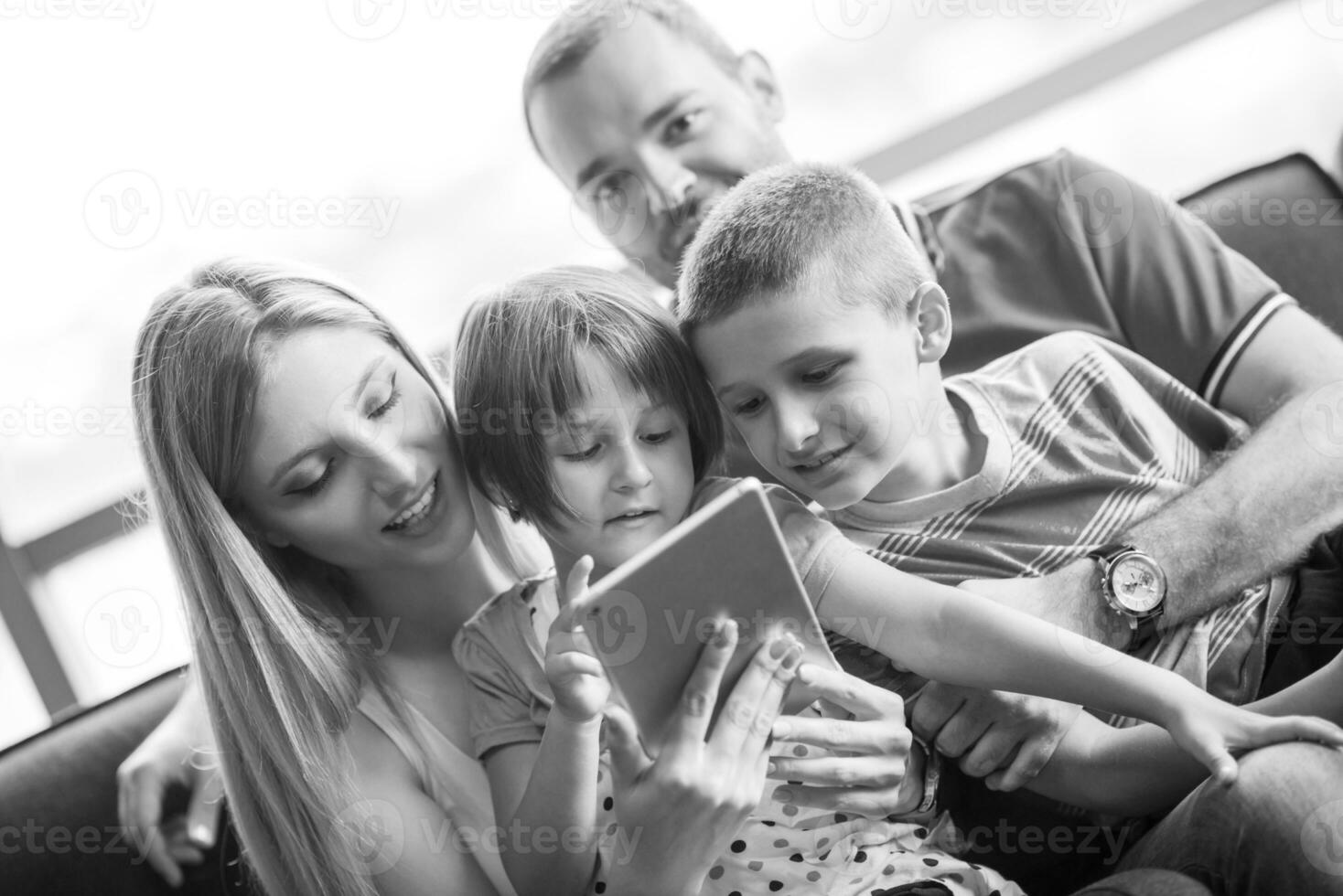 happy young couple spending time with kids photo
