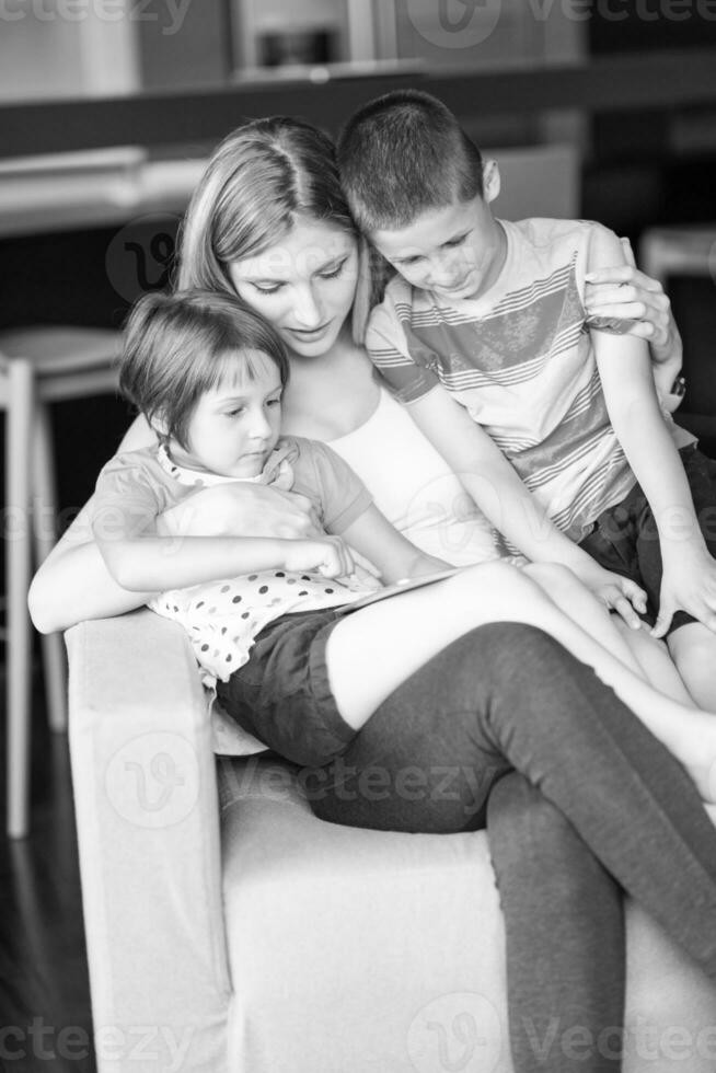 Young Family Using A Tablet To Make Future Plans photo