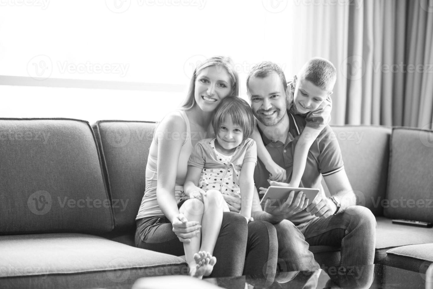 happy young couple spending time with kids photo