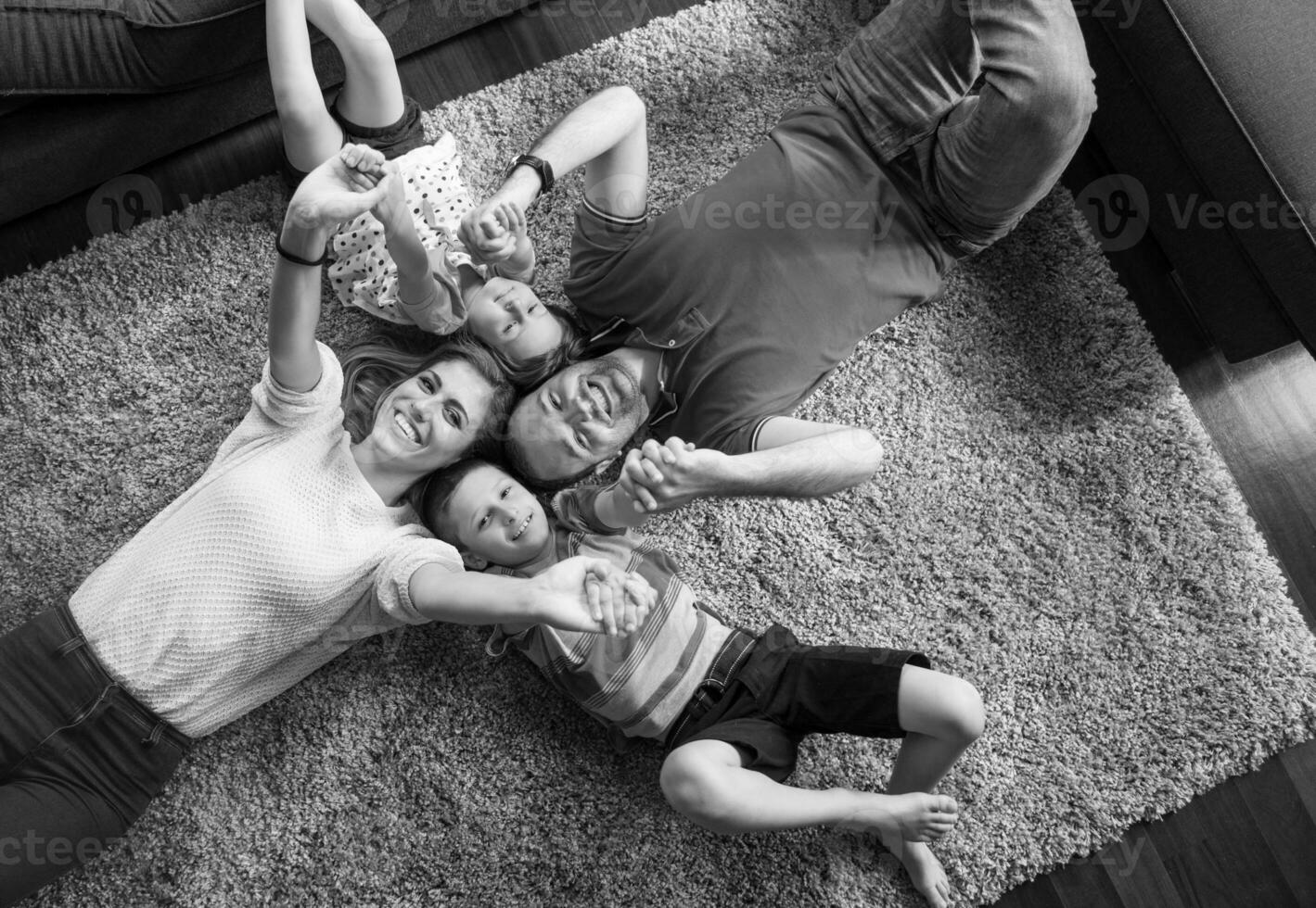 happy family lying on the floor photo