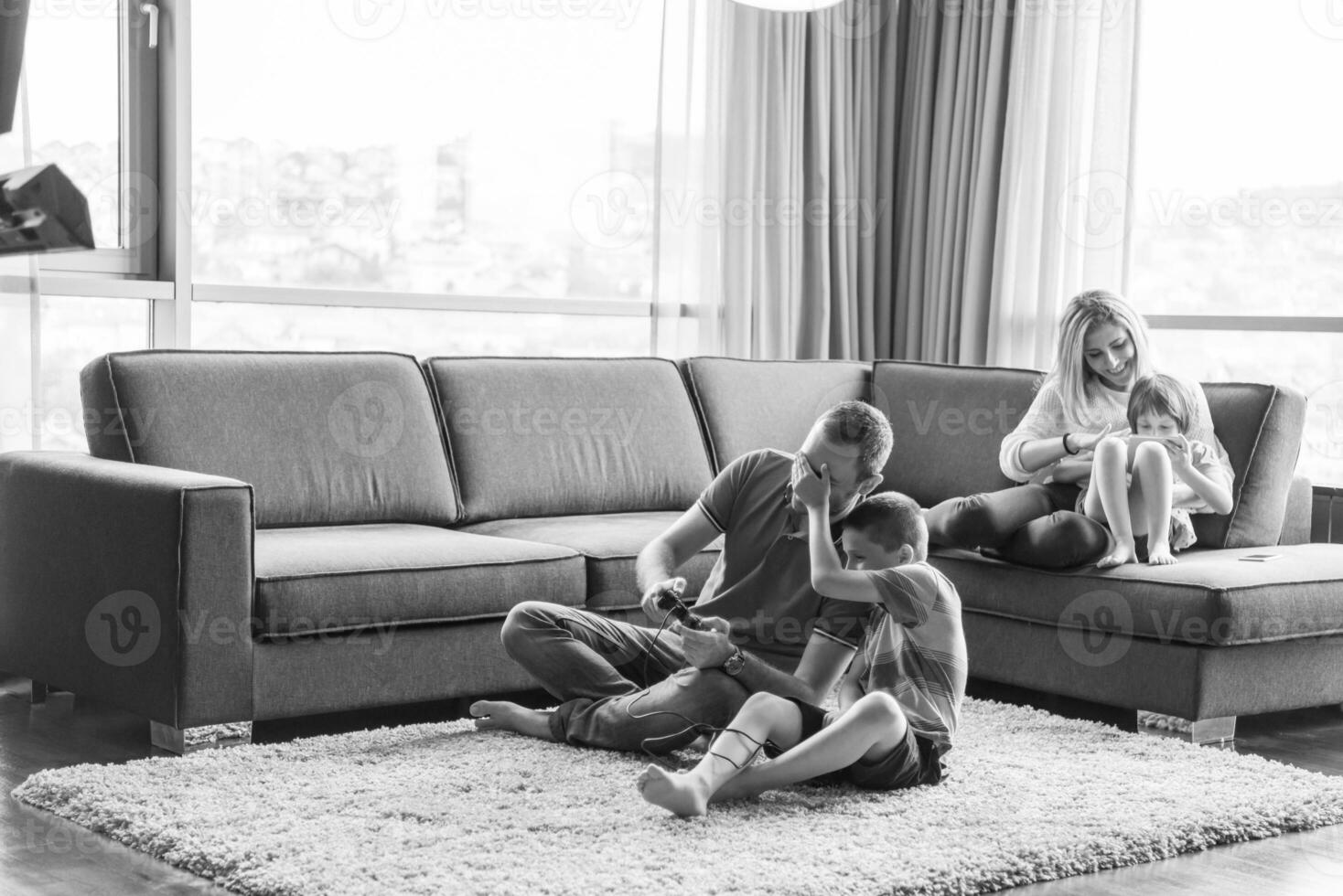 Happy family playing a video game photo