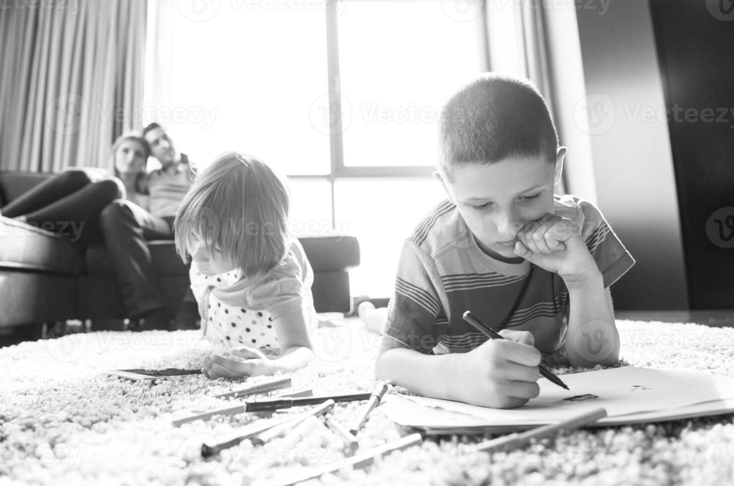 young couple spending time with kids photo