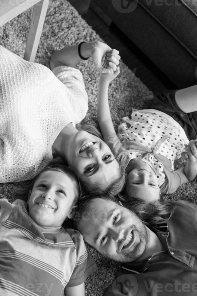 happy family lying on the floor photo