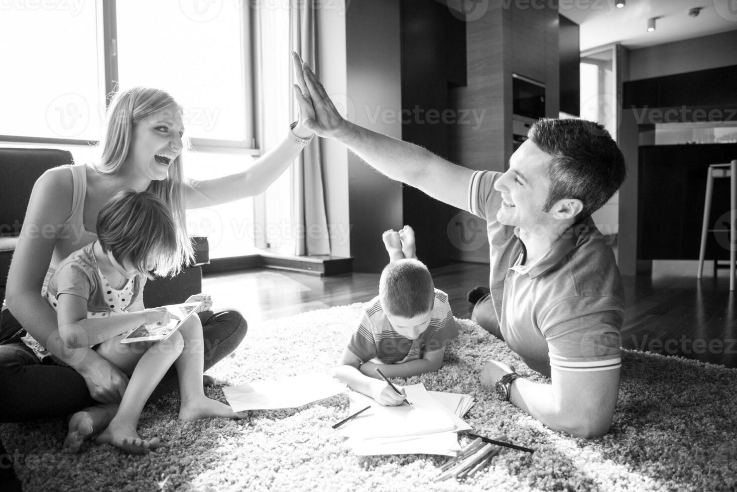 young couple spending time with kids photo