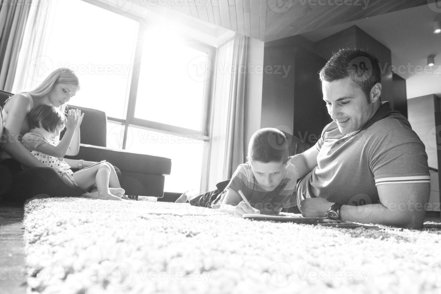 young couple spending time with kids photo