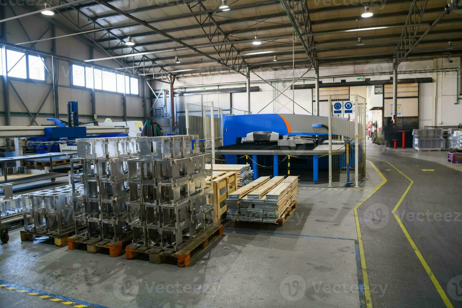 The first phase of metal and aluminum processing. Processed products from CNC machines stacked on a pallet in a large modern factory photo