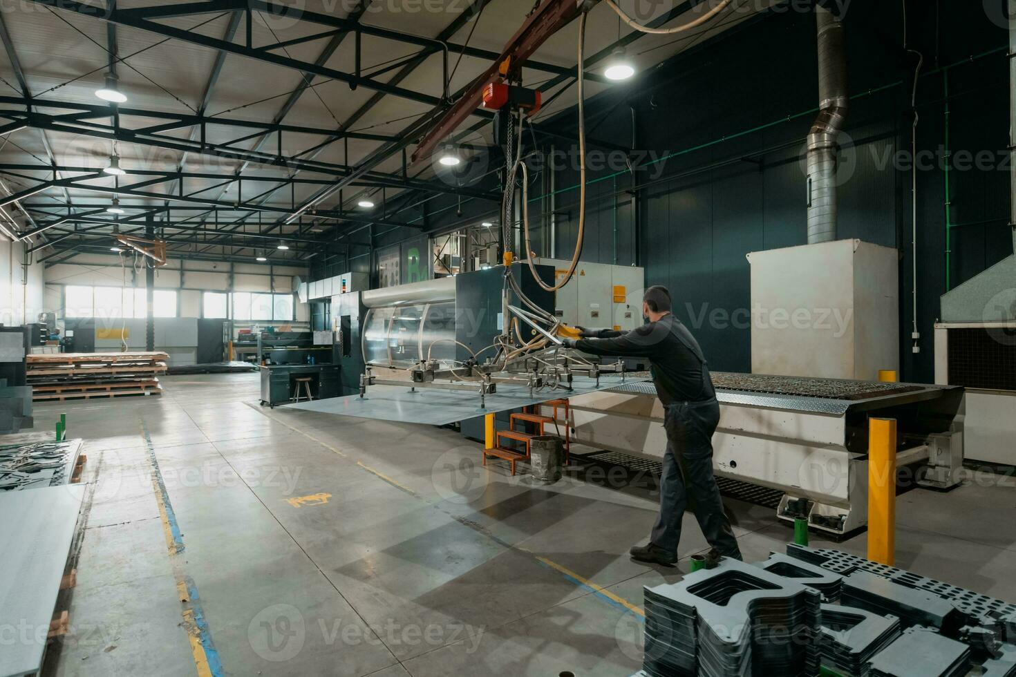 A smart factory worker or engineer wears a face mask because of a pandemic and makes machines in a production workshop. The concept of industry and engineering. photo
