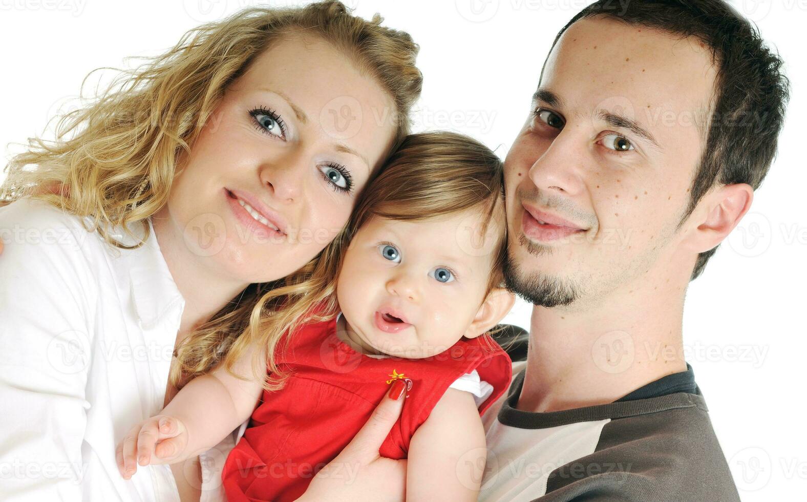 happy young family together in studio photo