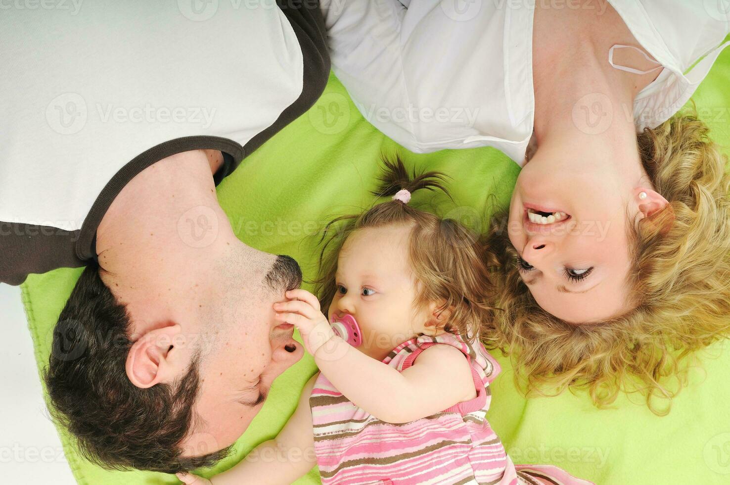 happy young family together in studio photo