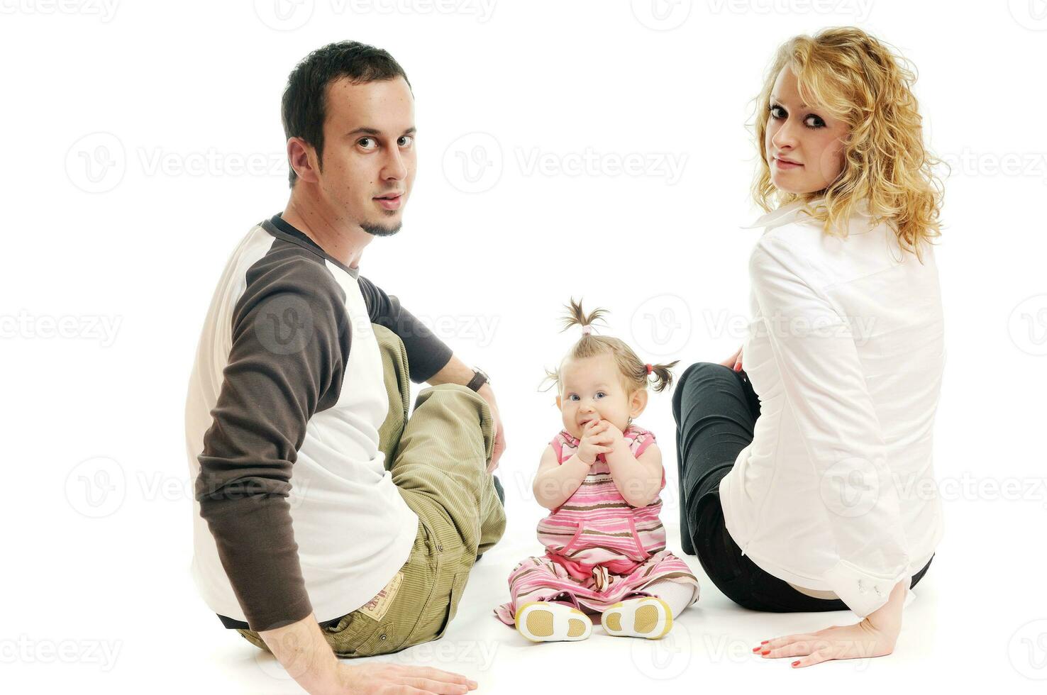 happy young family together in studio photo