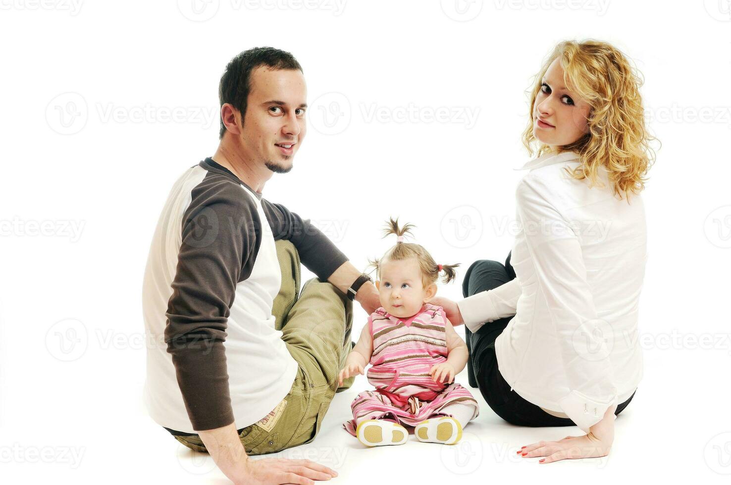 happy young family together in studio photo