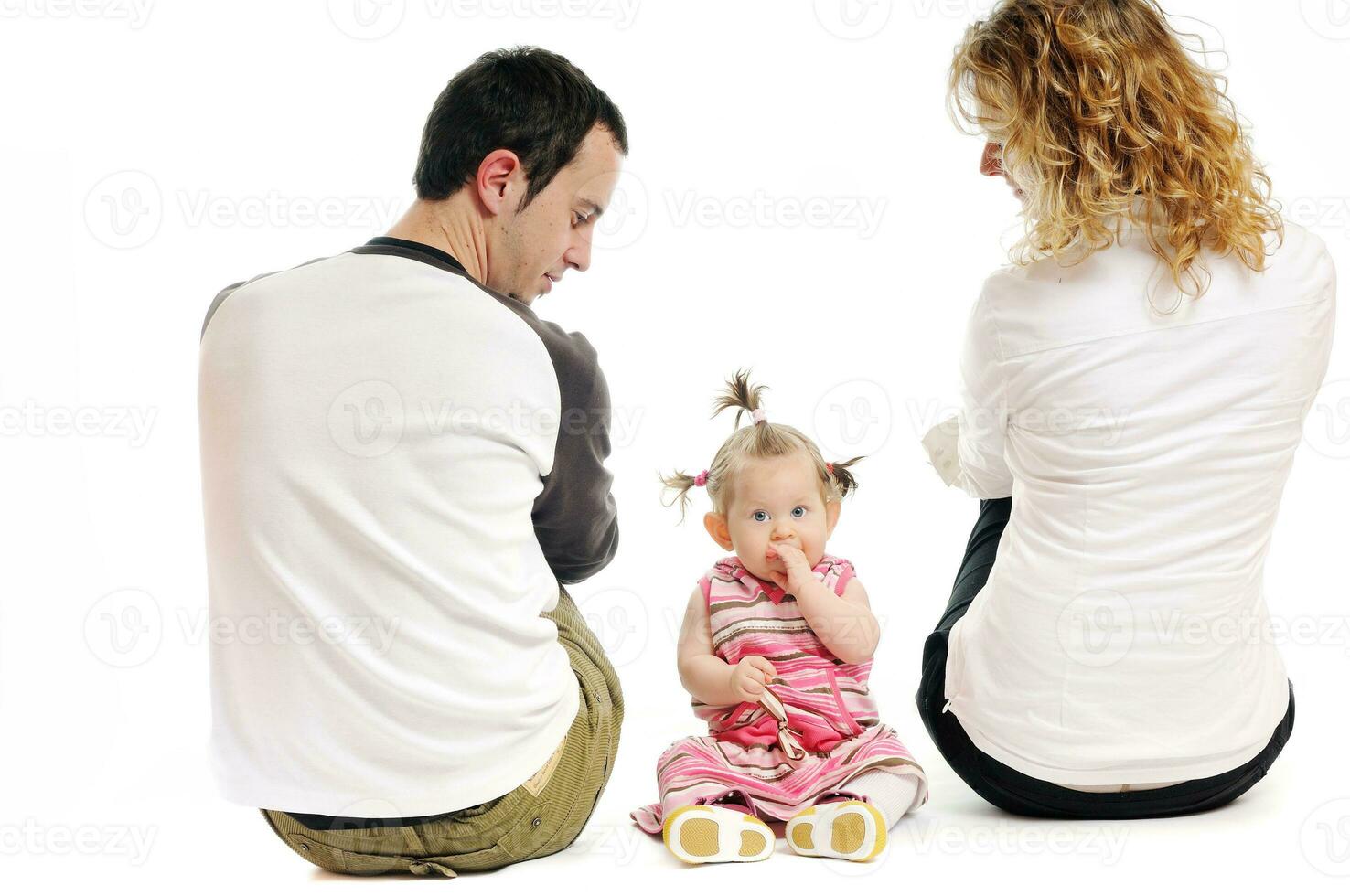 happy young family together in studio photo